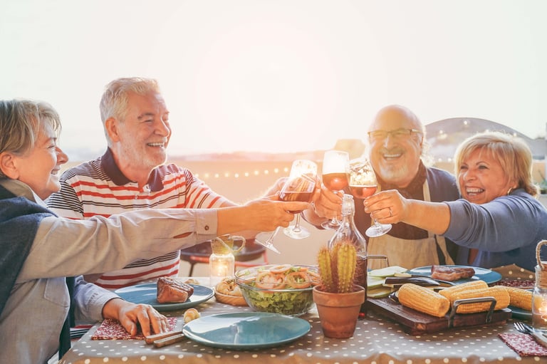 Group of seniors enjoying food and drinks
