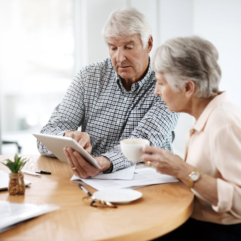 senior couple working with a tablet