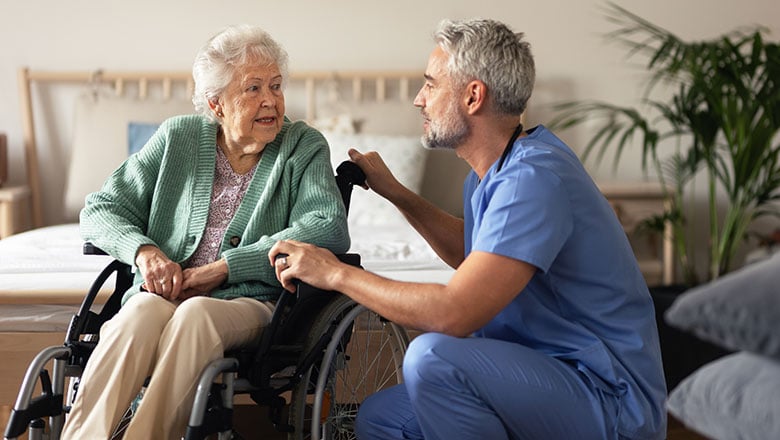 Caregiver doing regular check up of senior woman in her home