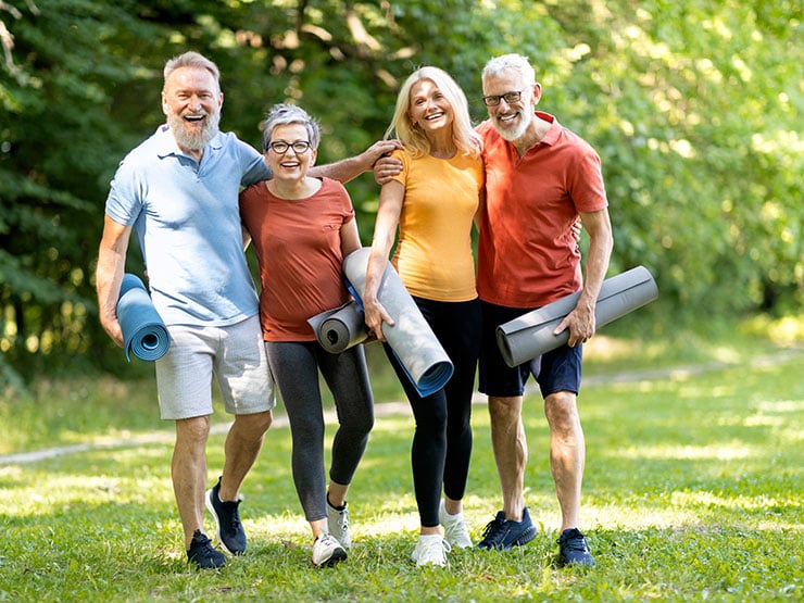 Senior group preparing to do exercise in the garden