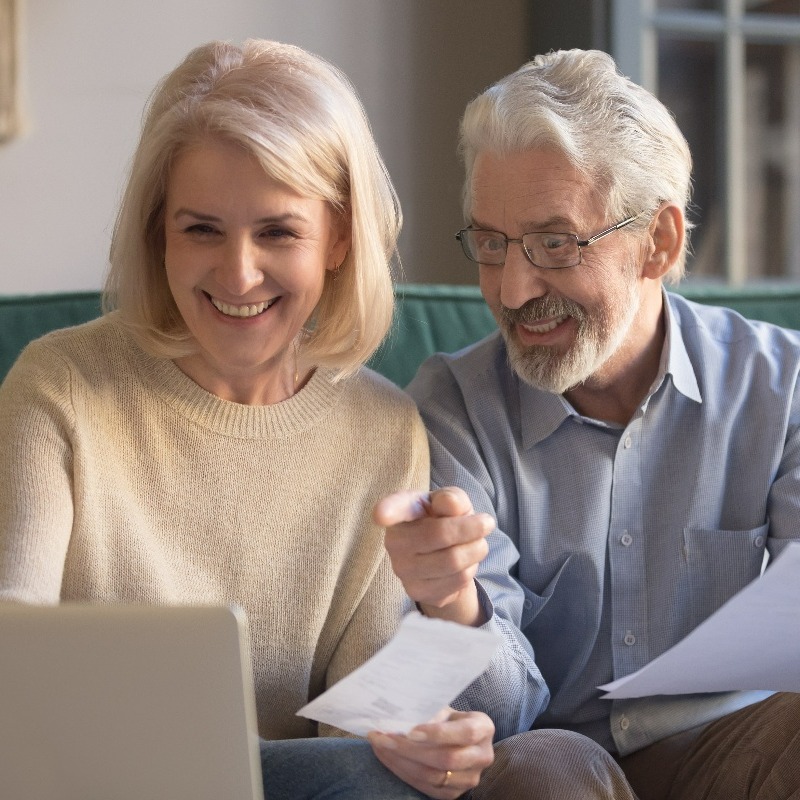 senior couple working on a laptop