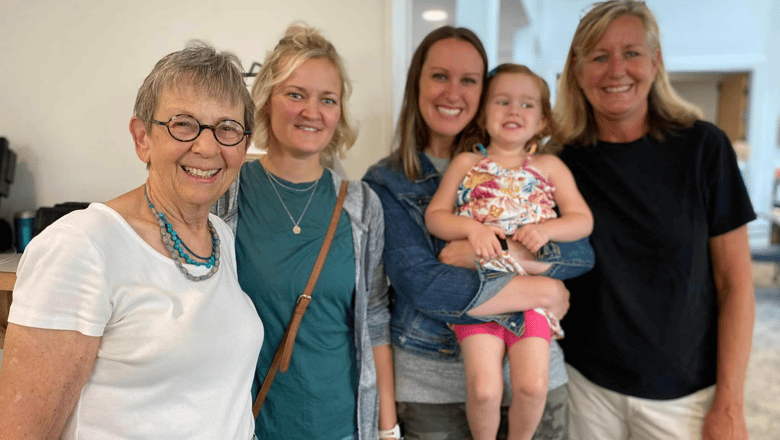 A group of people smiling at the camera